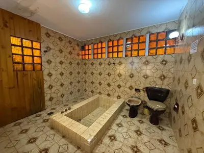 a bathroom with a tub and a toilet in it at Casa TOKIO in Villa Carlos Paz