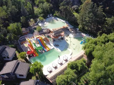an overhead view of a pool with a water park at Capri Hotel y Cabañas in Villa Carlos Paz