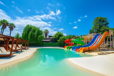 a water park with a colorful water slide at Capri Hotel y Cabañas in Villa Carlos Paz