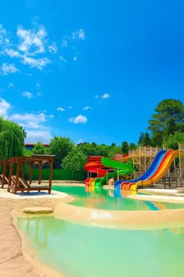 a water park with a colorful water slide at Capri Hotel y Cabañas in Villa Carlos Paz