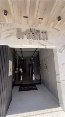 an entrance to a building with a sign on it at Departamento Premiun con Cochera en Villa Dolores in Villa Dolores