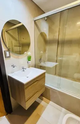 a bathroom with a sink and a shower at Departamento Premiun con Cochera en Villa Dolores in Villa Dolores