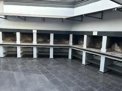 a row of white benches in a building at Dpto Carlos Paz in Villa Carlos Paz