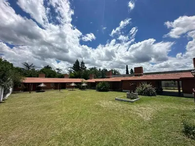 a large yard in front of a building at Shanti Cabañas in Mina Clavero