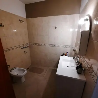 a bathroom with a sink and a toilet at El sueño de papá in Santa María