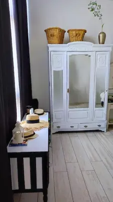 a white cabinet with baskets on top of it at La Preta, casa de campo in San Clemente