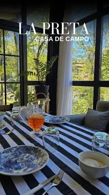 a blue and white table with plates and glasses on it at La Preta, casa de campo in San Clemente