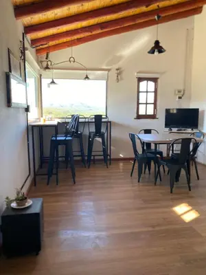a dining room with a table and chairs at La cuesta in Villa Cura Brochero