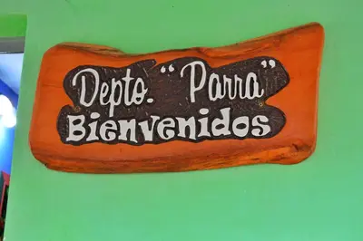 a sign that says potato pong bignyards on a wall at Departamento Parra in Panaholma