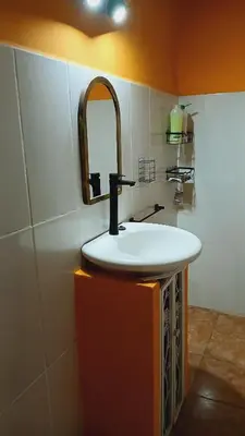 a bathroom with a sink and a mirror at Pacha es Arte in Villa Ciudad Parque