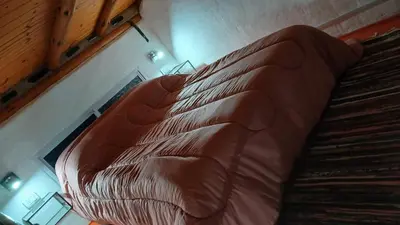 a large brown leather couch sitting on top of a staircase at Pacha es Arte in Villa Ciudad Parque