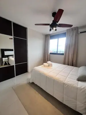 a bedroom with a bed with a ceiling fan at Departamento 1 dormitorio con Piscina y Gran Vista en Nueva Cordoba in Cordoba