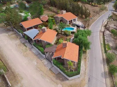an overhead view of a house with orange roofs at Cabañas La Morada de Tanti in Tanti