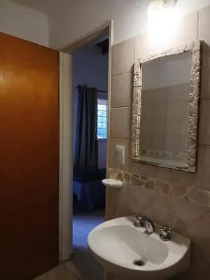 a bathroom with a sink and a mirror at Posada L'Agustina in Nono
