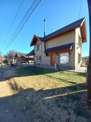 a house in the middle of a street at R y C Nuestro Lugar in Villa General Belgrano