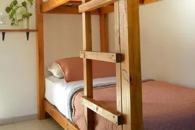 a bunk bed in a room with a bunk bedutenewayangering at Casa Revol céntrica ideal familias-grupos hasta 12 pax in Cordoba