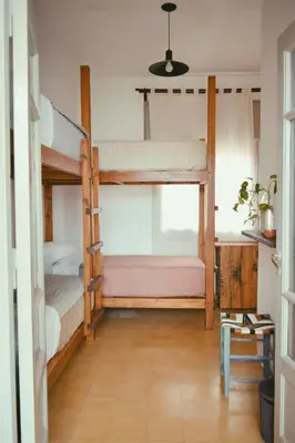 a room with two bunk beds and a table at Casa Revol céntrica ideal familias-grupos hasta 12 pax in Cordoba
