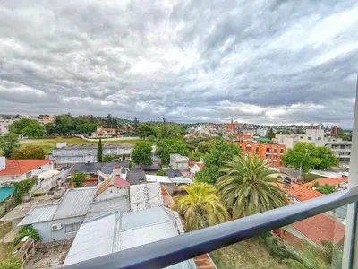 a view of a city from a balcony at PASEO QUATTRO Alquileres in Villa Carlos Paz
