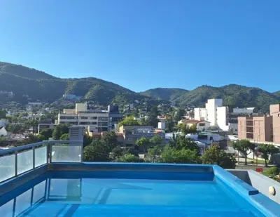 a swimming pool with a view of the city at Terraza Carlos Paz in Villa Carlos Paz