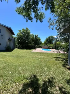 a view of a yard with a swimming pool at Las Tole - Potrero de Garay in La Estancia