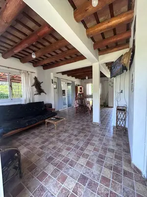 a living room with a couch and a table at Las Tole - Potrero de Garay in La Estancia