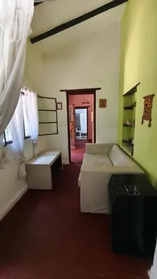 a hotel room with two beds and a window at Casa Megafó no in Las Rabonas