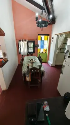 a dining room with a table and chairs in a room at Casa Megafó no in Las Rabonas