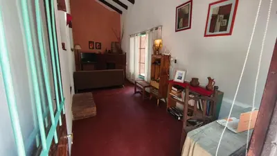 a living room with a table and a couch at Casa Megafó no in Las Rabonas