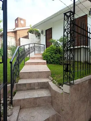 a set of stairs leading to a house at CASA PARA 5 CON PILETa in Villa Carlos Paz