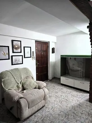 a living room with a couch and a television at CASA PARA 5 CON PILETa in Villa Carlos Paz