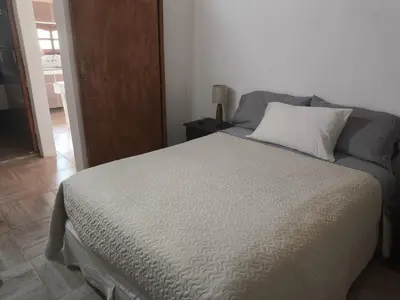 a bedroom with a bed with a pillow on it at Las Carolas in Santa María