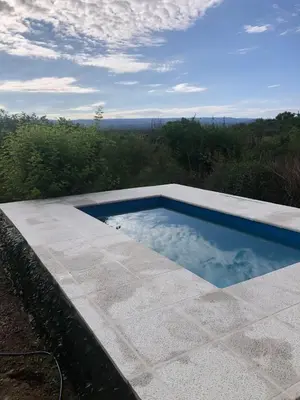 a swimming pool sitting on top of a patio at La casa de nona in Villa Carlos Paz