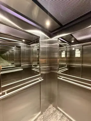 a walk in closet with glass doors and a ceiling at City Paz in Villa Carlos Paz