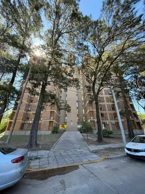 a large building with trees in front of it at Junior Towers Modern Apartment in Cordoba