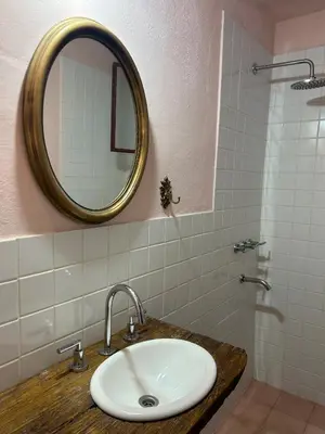 a bathroom with a sink and a mirror at Casa Puna in Alta Gracia