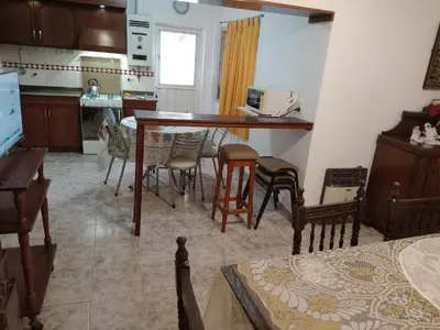 a kitchen and dining room with a table and chairs at Complejo Alfa Iii in Villa Carlos Paz