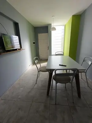 a dining room with a table and chairs at Depto Zenon para 3 personas in Pilar