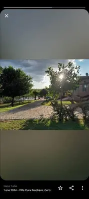 a picture of a tree with the sun shining on it at Cabañas Nuestro Valle Cura Brochero in Villa Cura Brochero