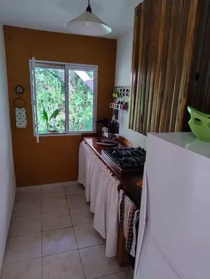 a kitchen with a counter with a stove and a window at Linaje del Champaqui - San Javier in Villa de Las Rosas
