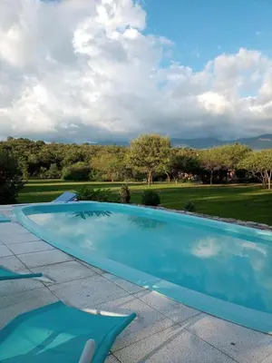 a blue swimming pool on top of a roof at Linaje del Champaqui - San Javier in Villa de Las Rosas