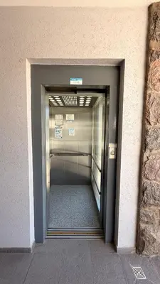 a hallway in a building with a walk way at Complejo Carde Housing in Villa Carlos Paz