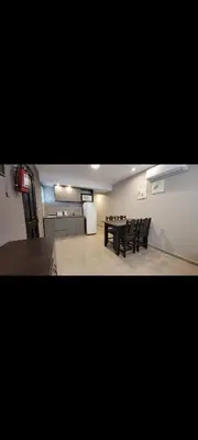 a dining room with a table and chairs in a room at Esencias Serranas in Cavalango