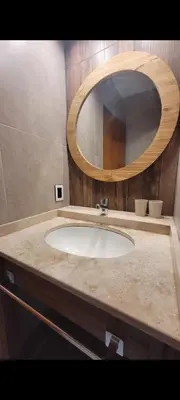 a bathroom with a sink and a mirror at Esencias Serranas in Cavalango