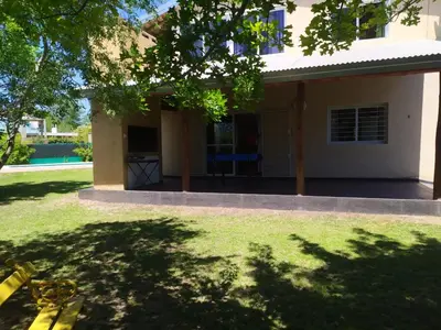 a view of a house with a yard at Las Tole - Potrero de Garay in La Estancia