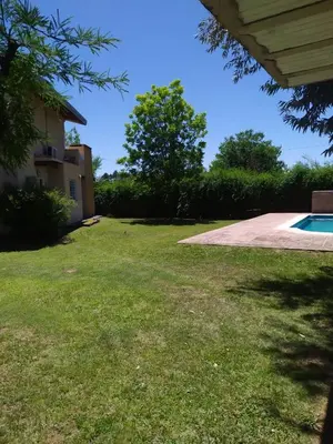 a yard with a house and a swimming pool at Las Tole - Potrero de Garay in La Estancia