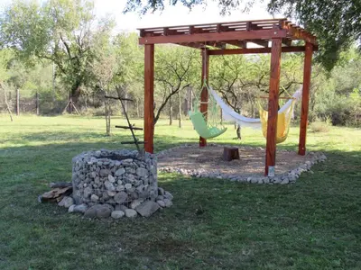 a playground with a hammock and a pavilion at cabaña el lago in San Ignacio