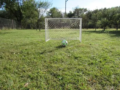 a soccer ball sitting in front of a goal at cabaña el lago in San Ignacio