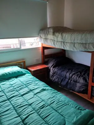 a bedroom with two bunk beds and a bed at cabaña el lago in San Ignacio