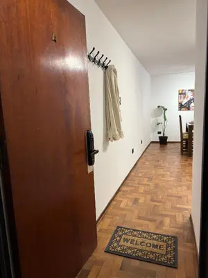 a room with a door and a hallway with a rug at Horse Petit Apartments in Cordoba