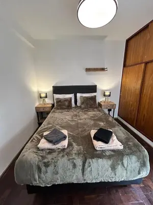 a bedroom with a large bed with two pillows on it at Practico y tranquilo Departamento en Alberdi in Cordoba